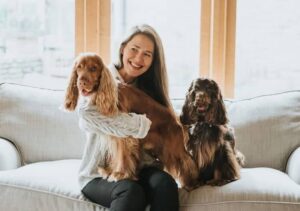 two cocker spaniels with woman